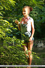 Alisabelle alisabelle playfully poses outdoors as she bares her petite body.